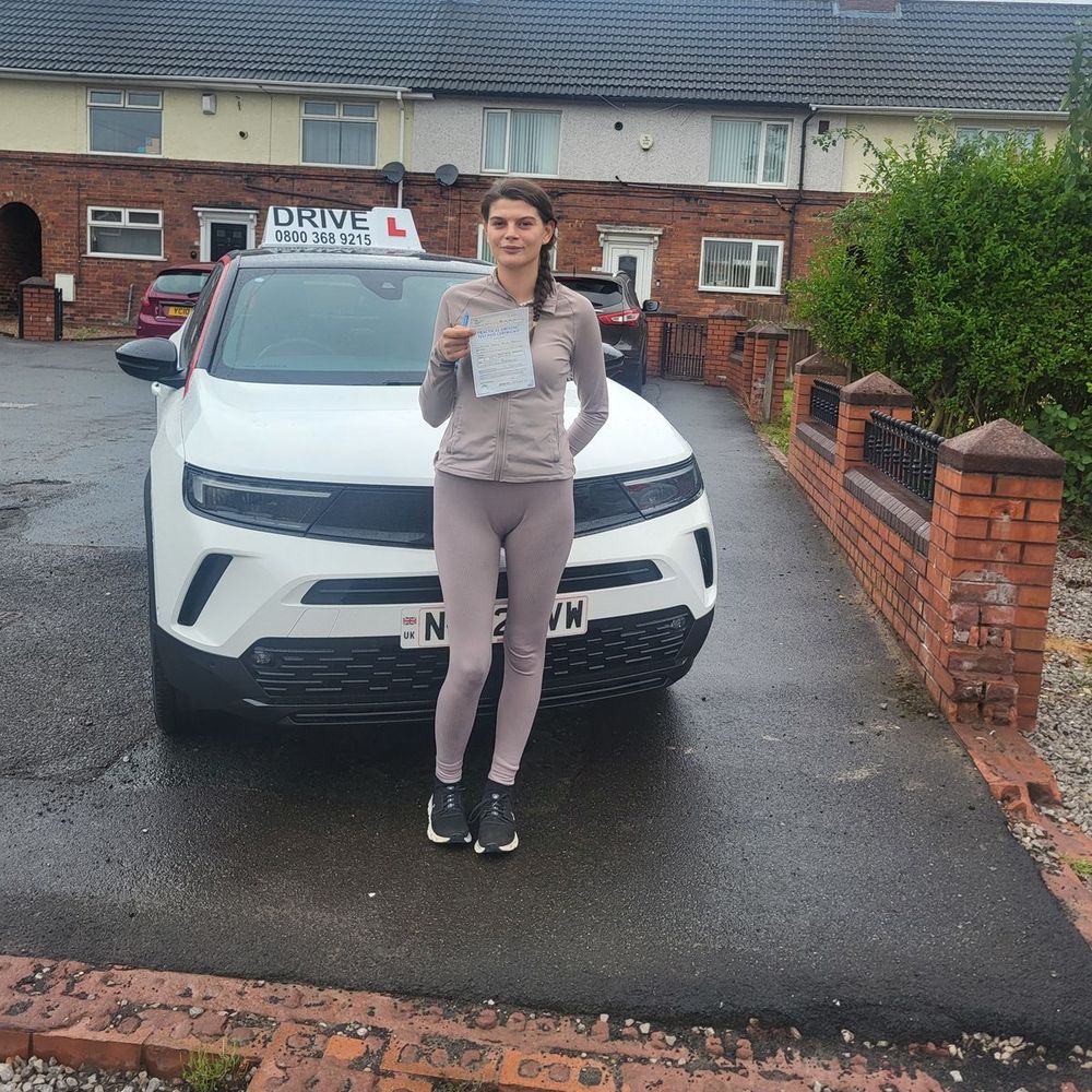 Pupil with her driving test pass certificate after lessons with Pass with Daz in Dodworth